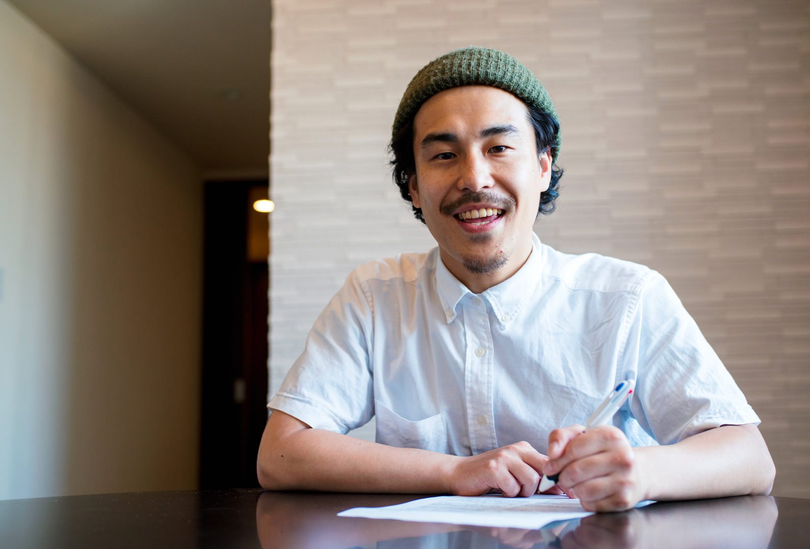 man writing on paper